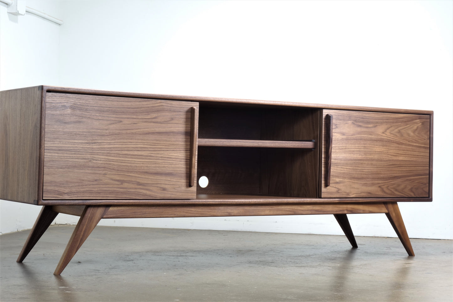 Close-up of the BlackGold credenza’s record storage compartments, featuring dividers for vinyl organization