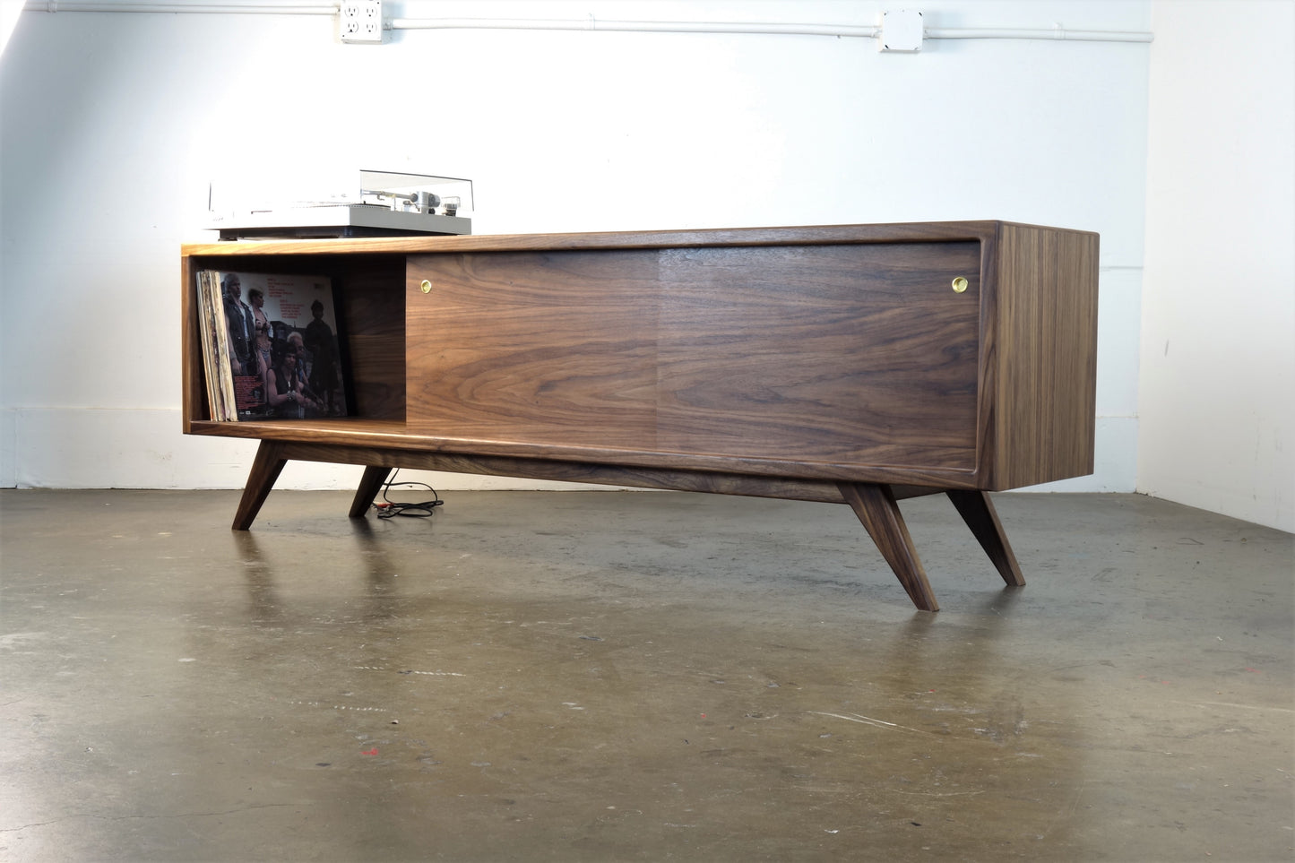 Close-up of the BlackPearl record storage console compartments, designed for displaying and organizing vinyl recor