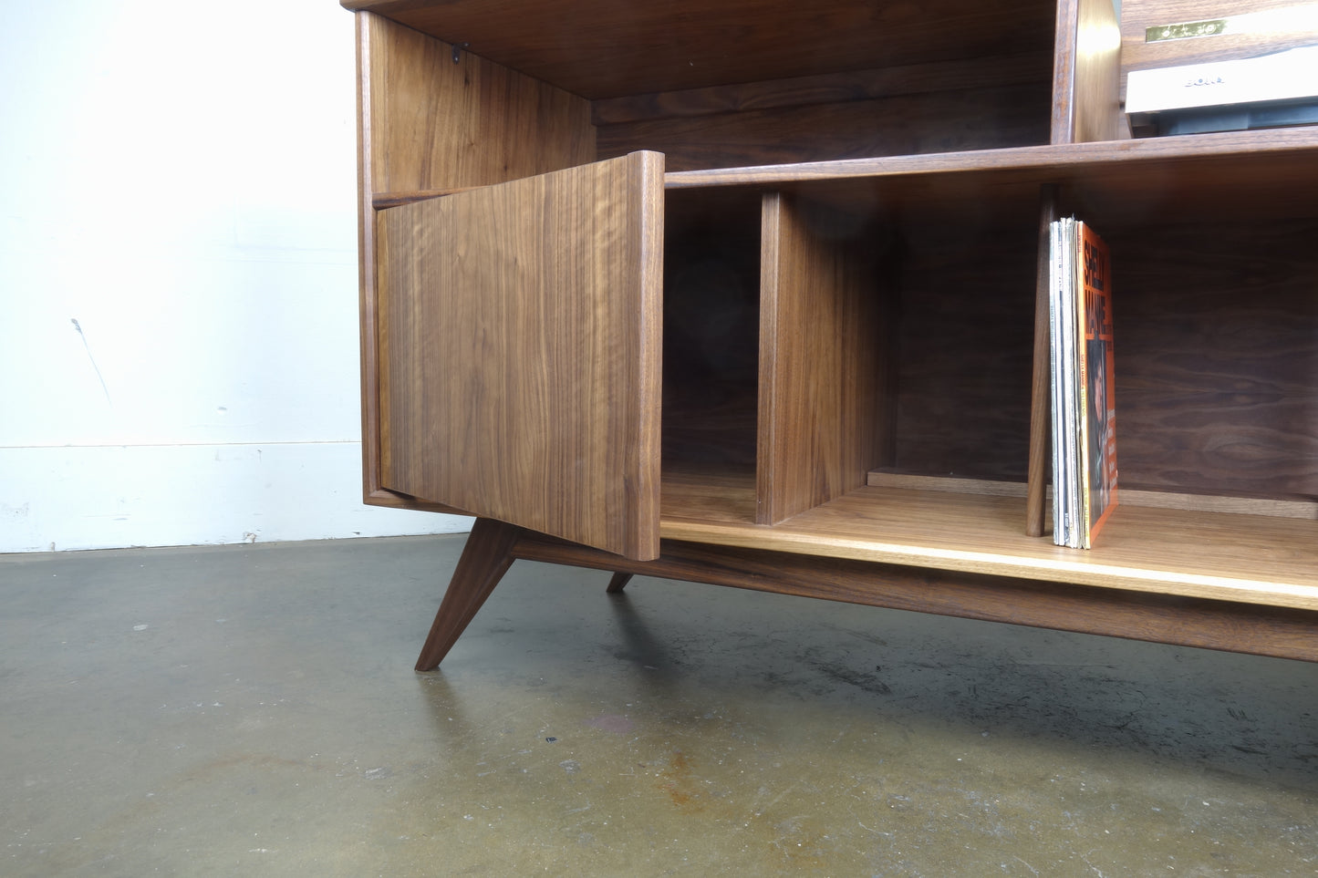 Interior view of the Electric Koolaide credenza featuring dedicated record storage compartments with dividers for vinyl organization