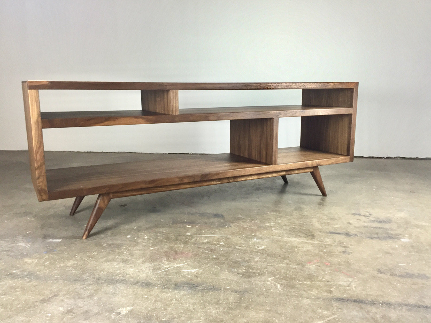 Close-up image of the natural walnut wood grain on the Bacon console, showcasing its unique, handcrafted patterns.