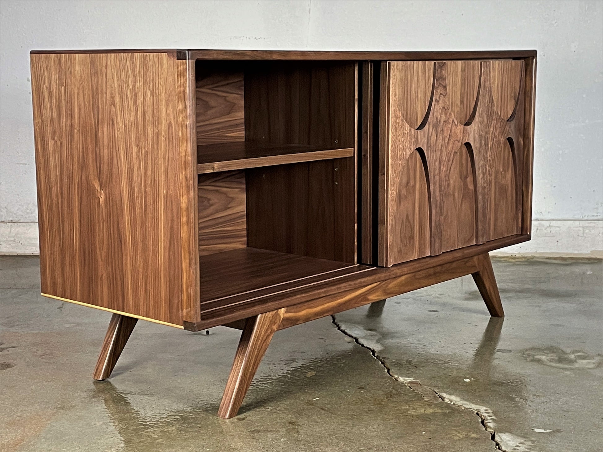 Interior view of the BRC credenza with adjustable shelves, notched for easy wire access and versatile storage options