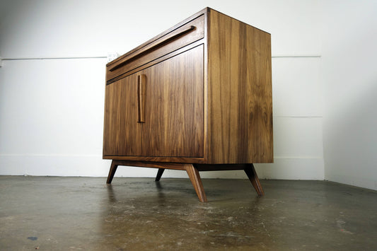 Side view of the Brick credenza showcasing its compact design, smooth walnut finish, and mid-century modern craftsmanship