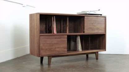 Close-up of the DoubleUp console’s two sliding doors, designed for easy access to record storage and hidden compartments