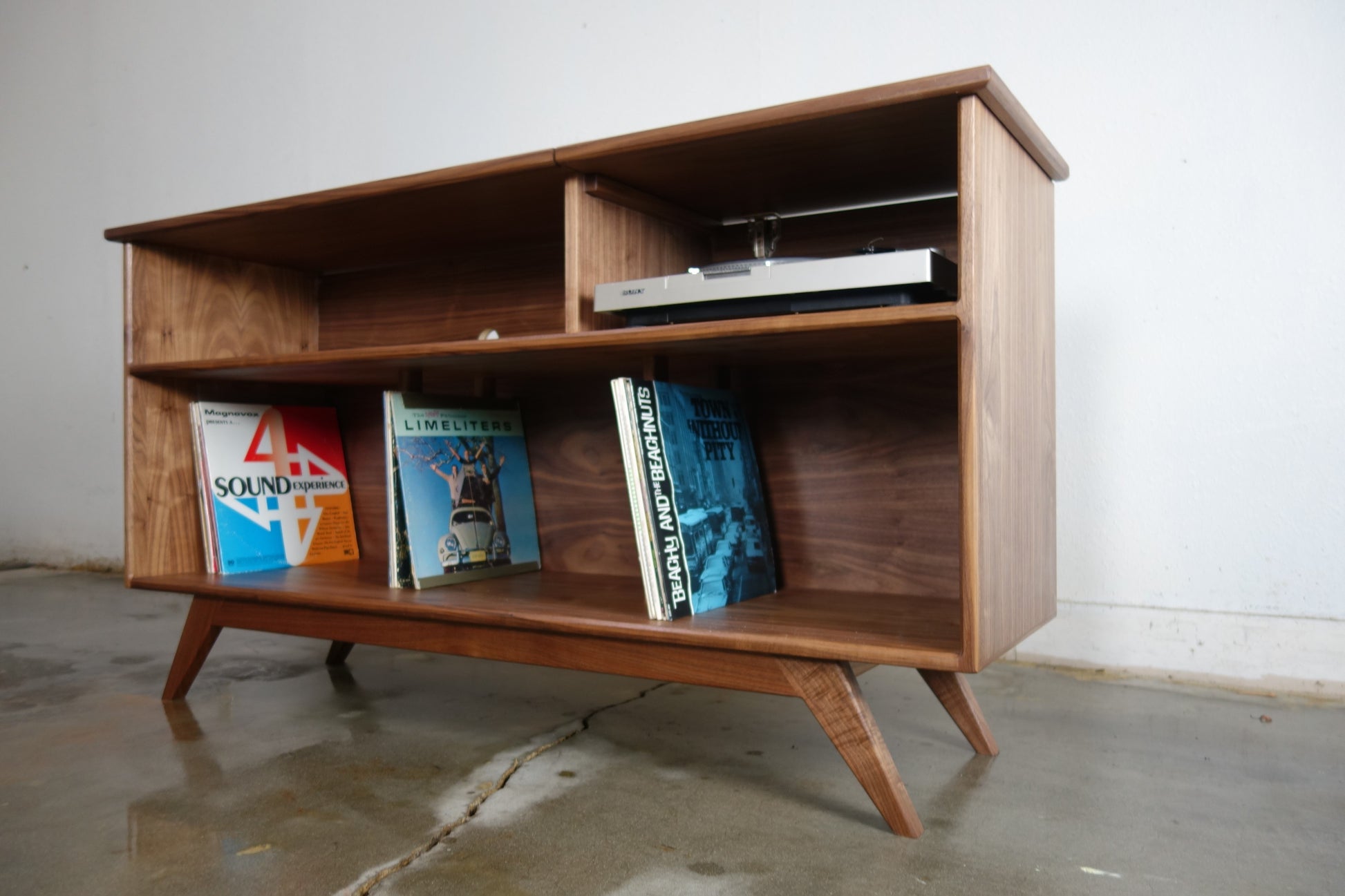 Interior compartments of the Dyno credenza designed to store records and audio equipment securely and stylishly