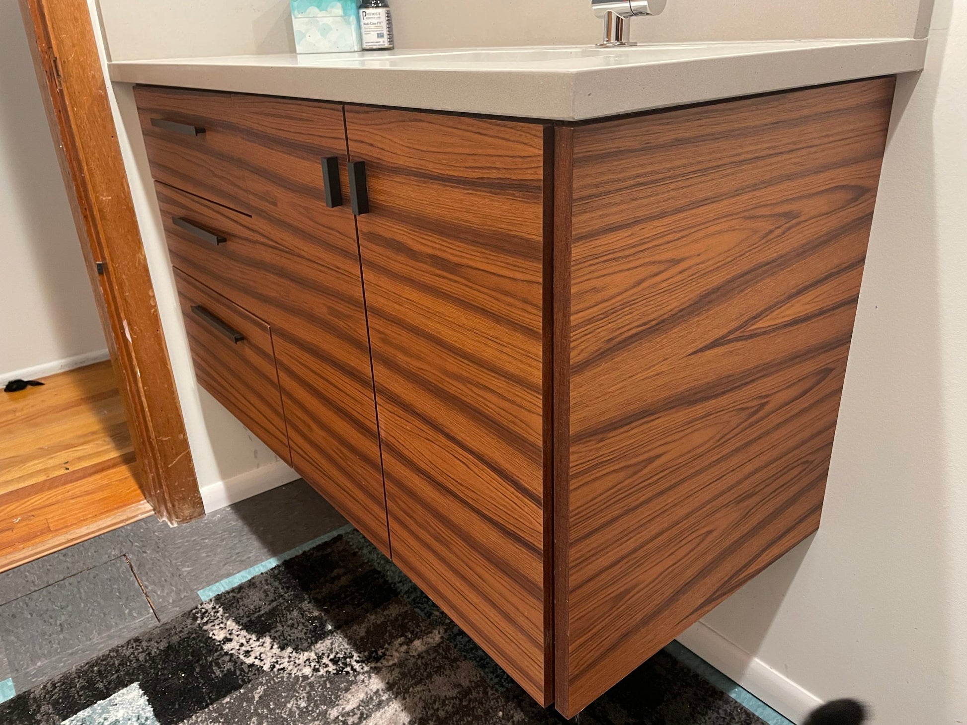 Front view of the floating vanity featuring one sink, a single drawer bank, and durable real wood veneer construction