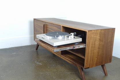 Detailed view of the record storage compartments inside the GoldenGirl credenza, perfect for organizing vinyl records behind closed doors