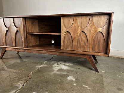 Top view of the Bagel credenza with its hand-applied natural finish and distinct walnut wood grain pattern