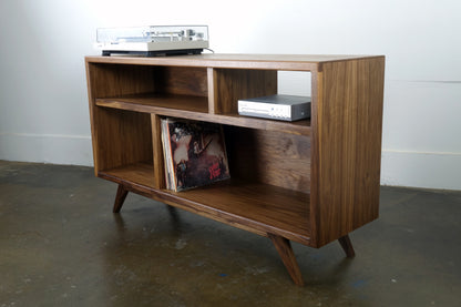 Side view of a handmade record storage console made from solid walnut, showing its heirloom-quality craftsmanship.