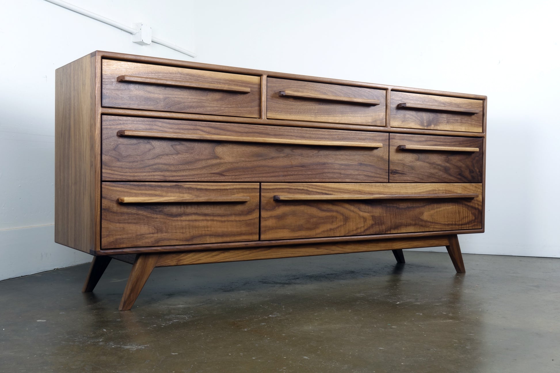 Side view of the JellyBean dresser showcasing its clean lines, solid walnut construction, and timeless craftsmanshi