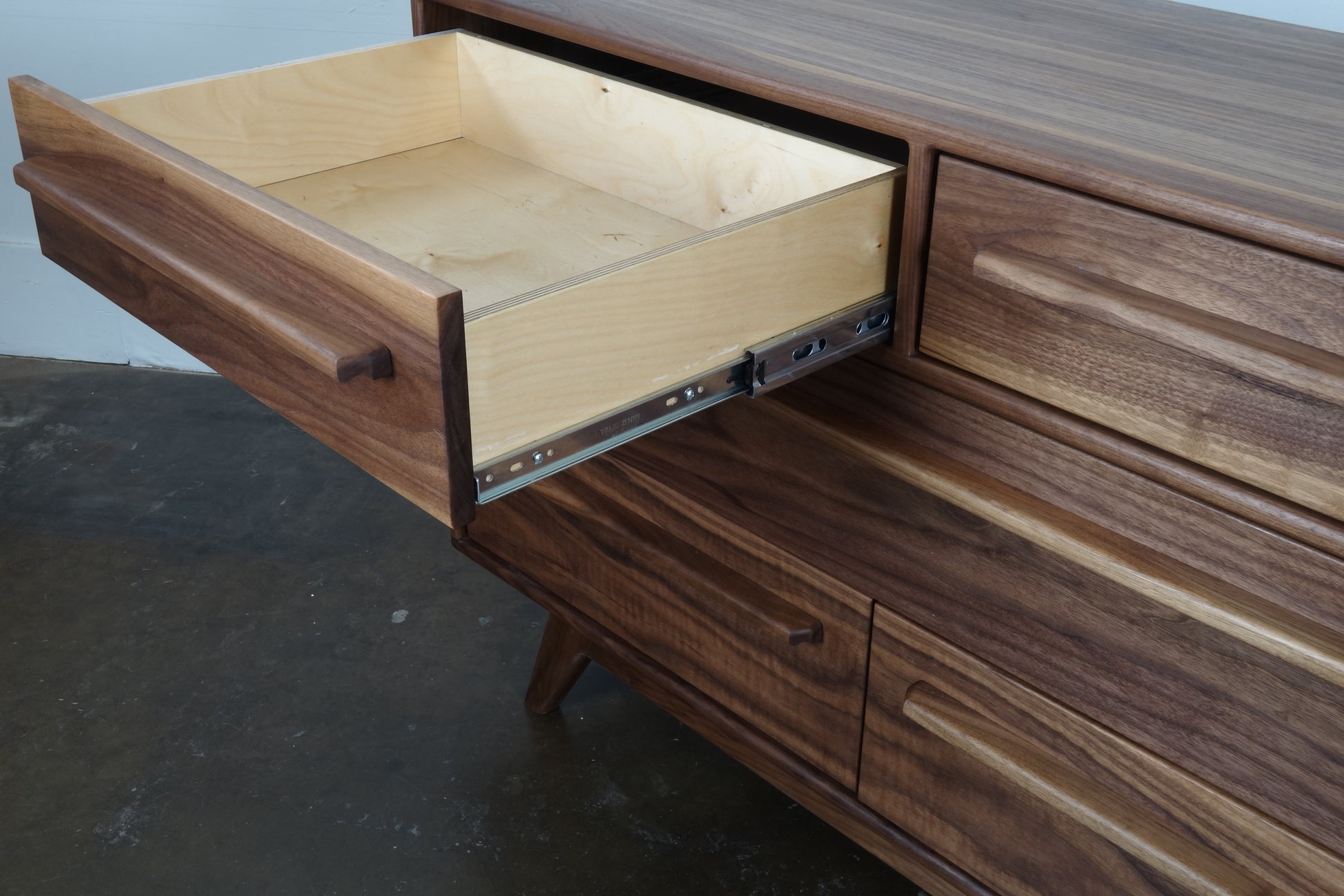 Close-up of the JellyBean dresser drawer, featuring full-extension slides and baltic birch construction for durability