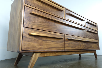 Close-up of the natural walnut wood grain on the JellyBean dresser, highlighting its unique patterns and hand-applied oil and wax finish