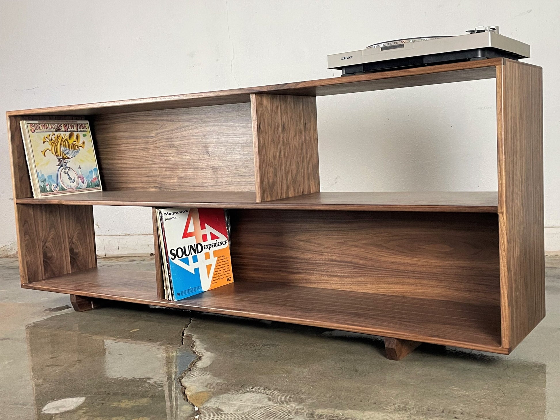 Front view of the JoyFlake console, a two-tiered mid-century modern walnut piece designed for extra record storage