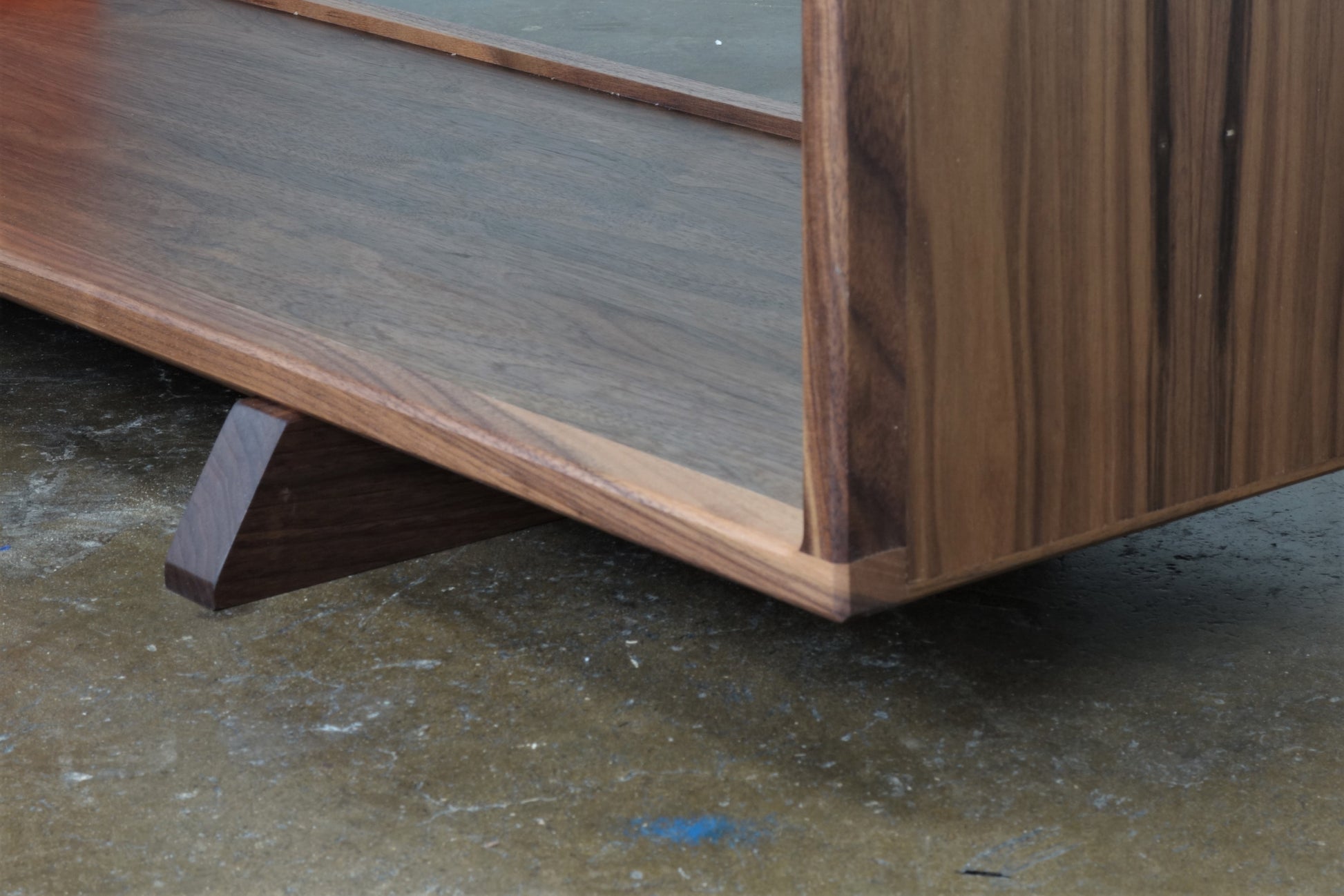 Close-up of the JoyFlake console’s mid-century modern-inspired legs, angled for stability and elegant style