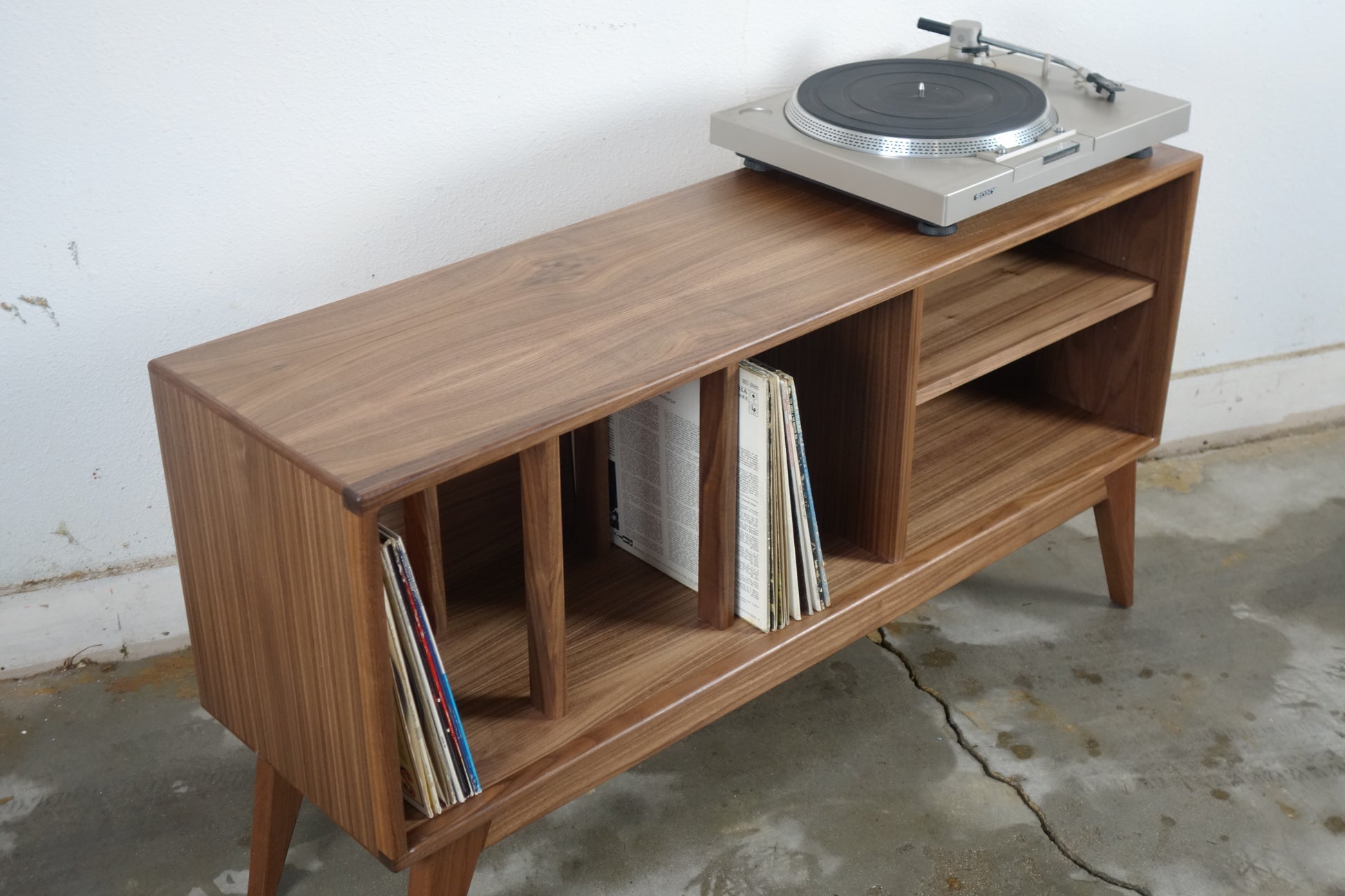 The K Blast console’s compact size and sleek mid-century modern design, perfect for smaller living spaces