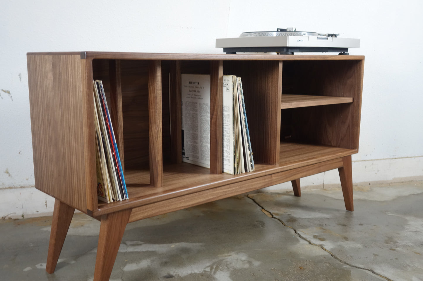 Side view of the K Blast console showcasing its compact design, ideal for small spaces and vinyl record collectors