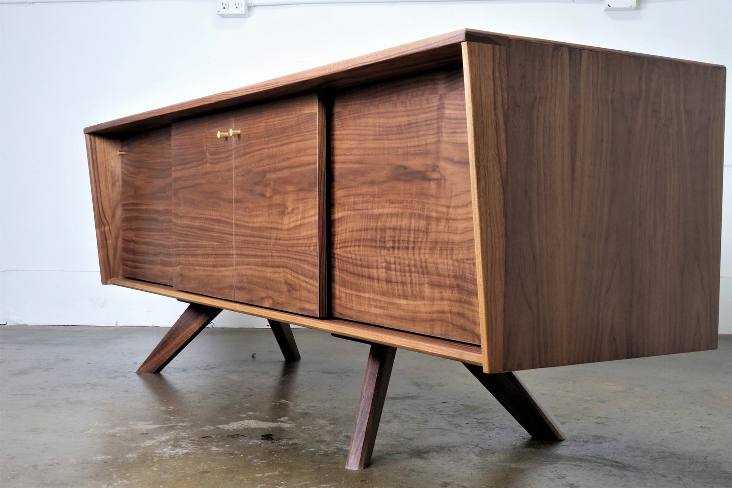 Side view of the LazyBoy console showcasing its elegant silhouette, solid walnut construction, and heirloom-quality craftsmanship