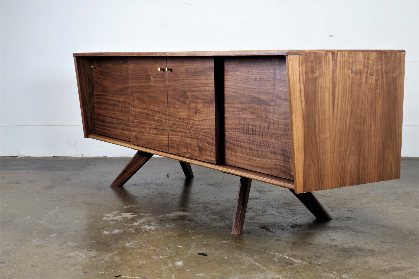 Close-up of the natural walnut wood grain on the LazyBoy console, finished with hand-applied oil and wax for a smooth look