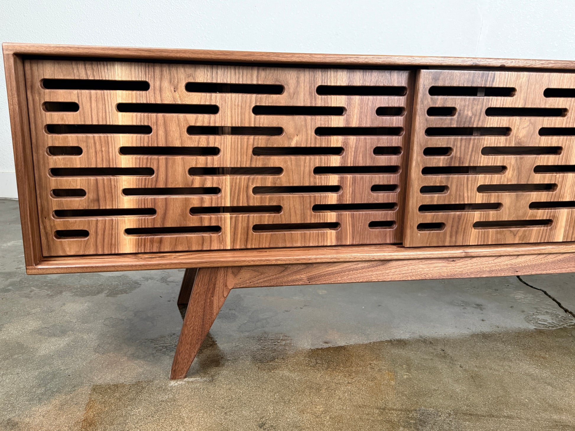 Mid century modern walnut credenza handcrafted from premium hardwood and veneer.