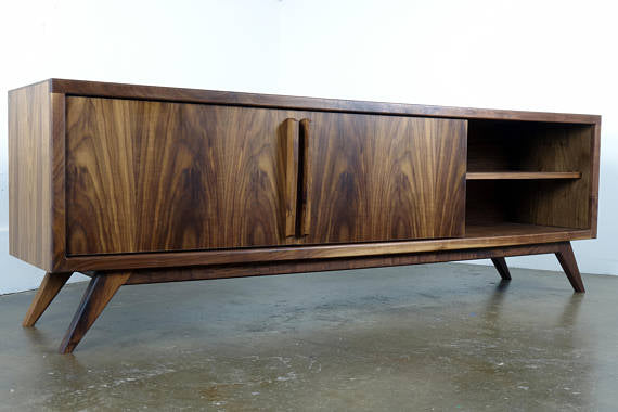 Front view of the Lemonade console, a handcrafted walnut piece with two sliding doors and adjustable shelves in a mid-century modern design