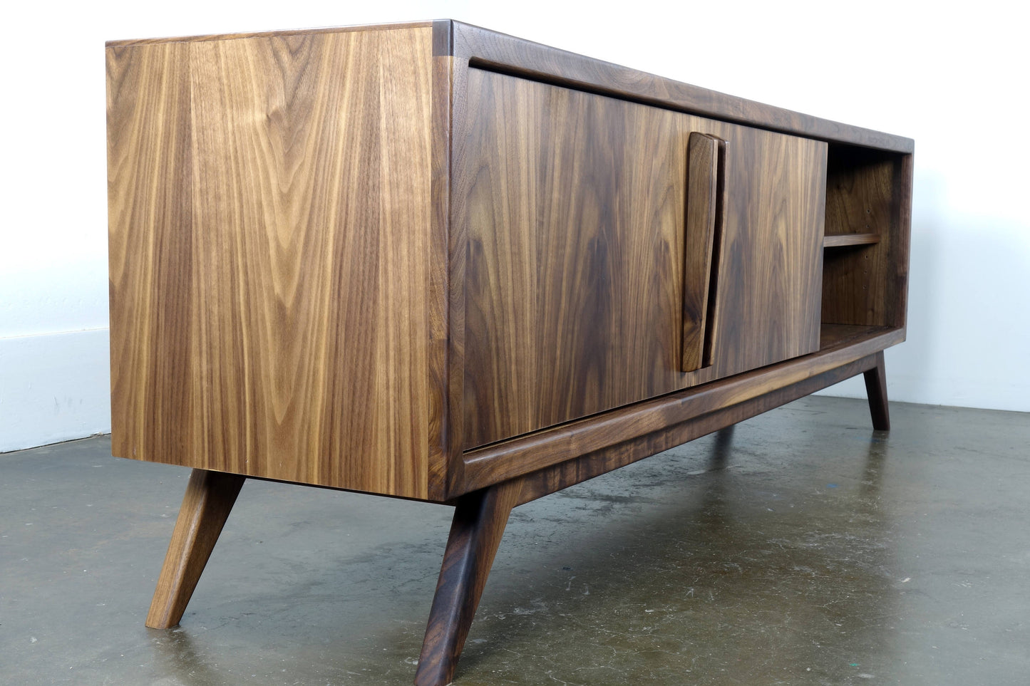 Close-up of the Lemonade console’s mid-century modern legs, crafted for stability and elegant styling