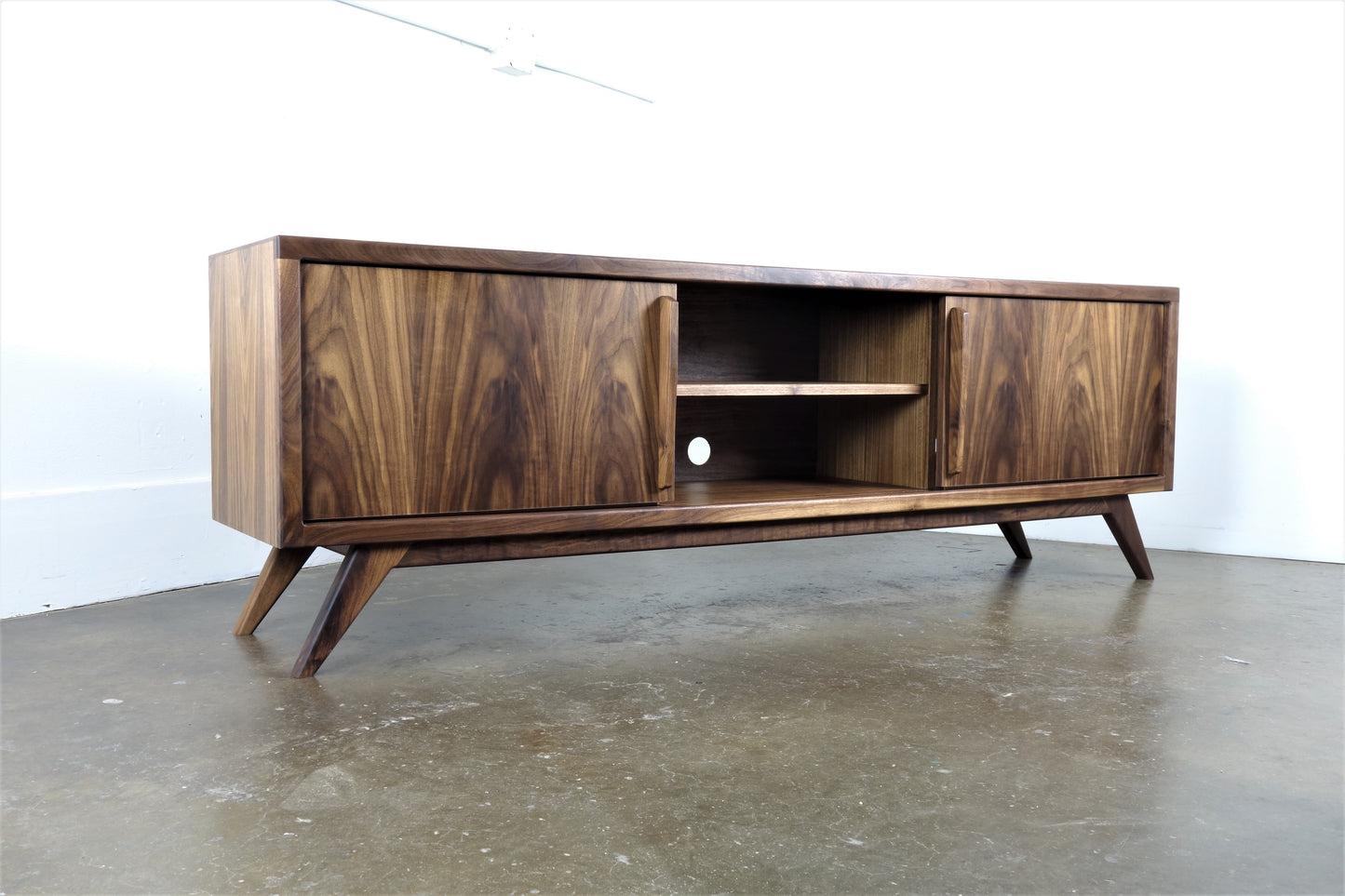 Side view of the Lemonade console highlighting its sleek profile, clean lines, and heirloom-quality walnut construction