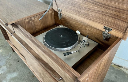 Close-up of the Nanoo credenza’s flip top, designed for easy access to the record player compartment