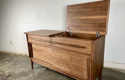 Side view of the Nanoo credenza highlighting its mid-century modern design, clean lines, and smooth walnut construction