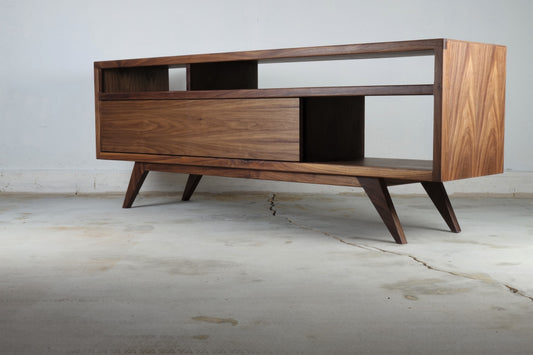 Front view of the PorkChop console, handcrafted in walnut with two sliding doors and a classic mid-century modern design