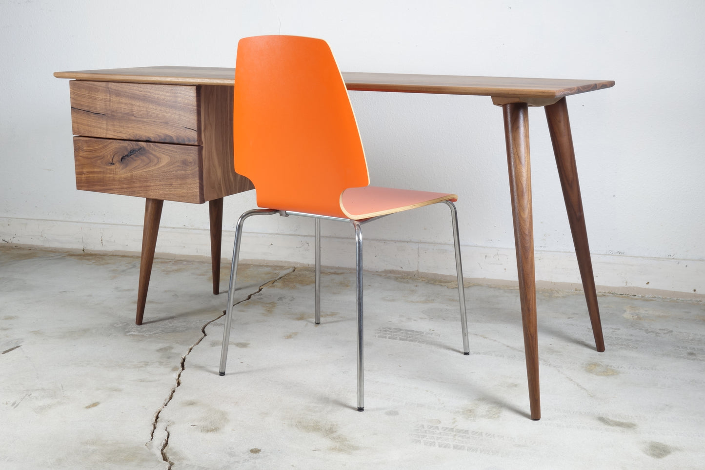 Front view of the SnowCone desk, a sleek mid-century modern inspired piece handcrafted from solid walnut and walnut veneer