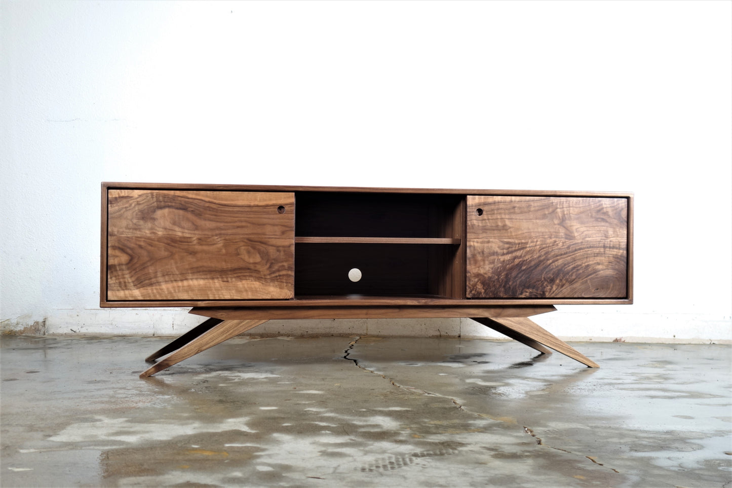 Close-up of the mid-century modern inspired legs on the Sonic Reducer credenza, crafted for durability and style