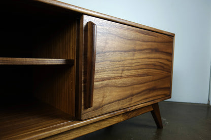 Close-up of the natural walnut wood grain on the StarDust console, highlighting the unique patterns and hand-applied oil and wax finish