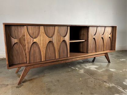 Front view of the Stella-J credenza, hand-built from walnut with three sliding doors and a timeless mid-century modern design