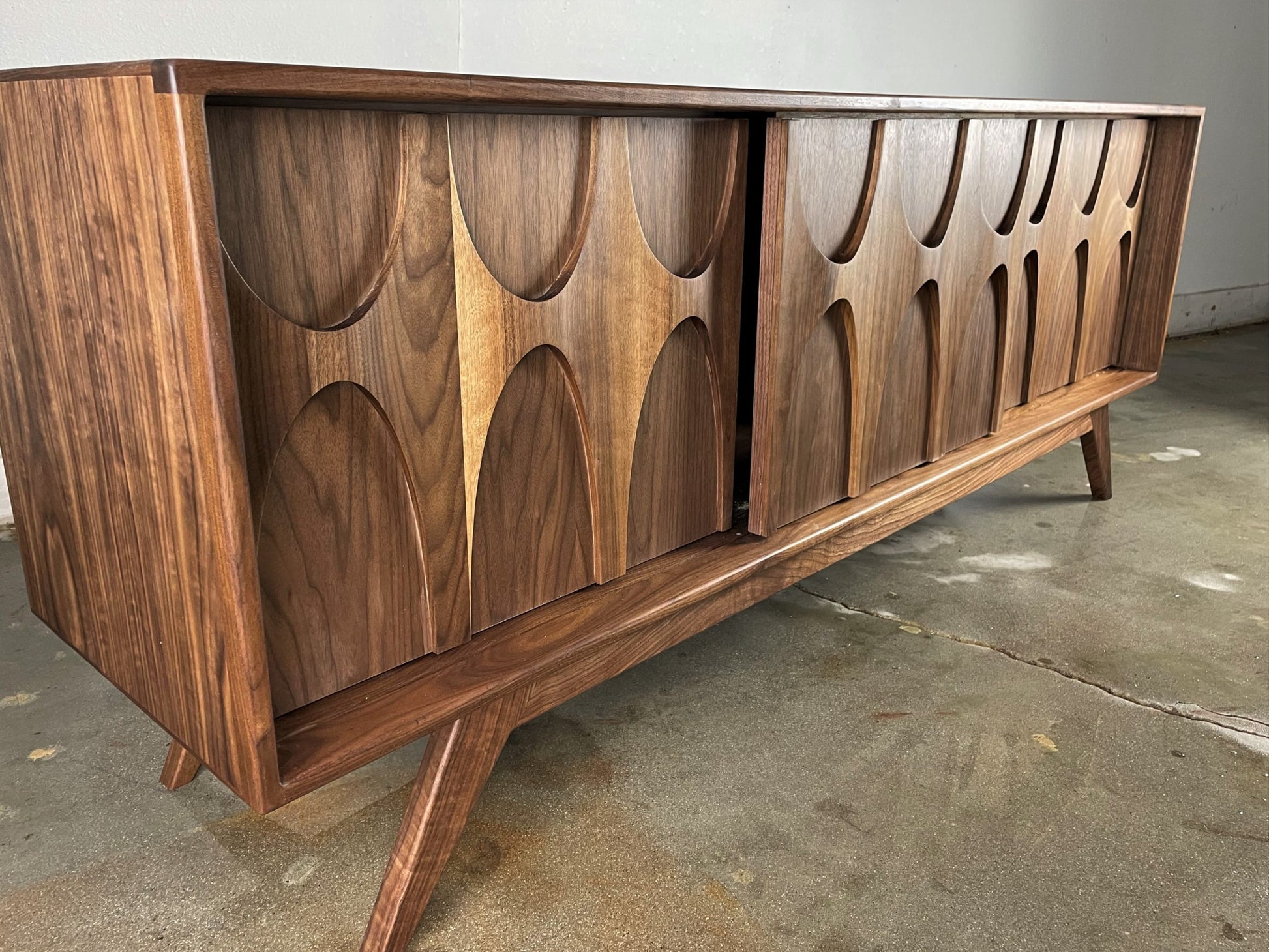 Close-up of the Stella-J credenza’s mid-century modern inspired legs, crafted for stability and sophisticated styling