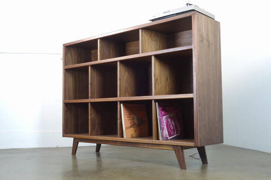 Side view of the StudioK credenza showcasing its clean lines, tall proportions, and durable solid and veneer walnut materials