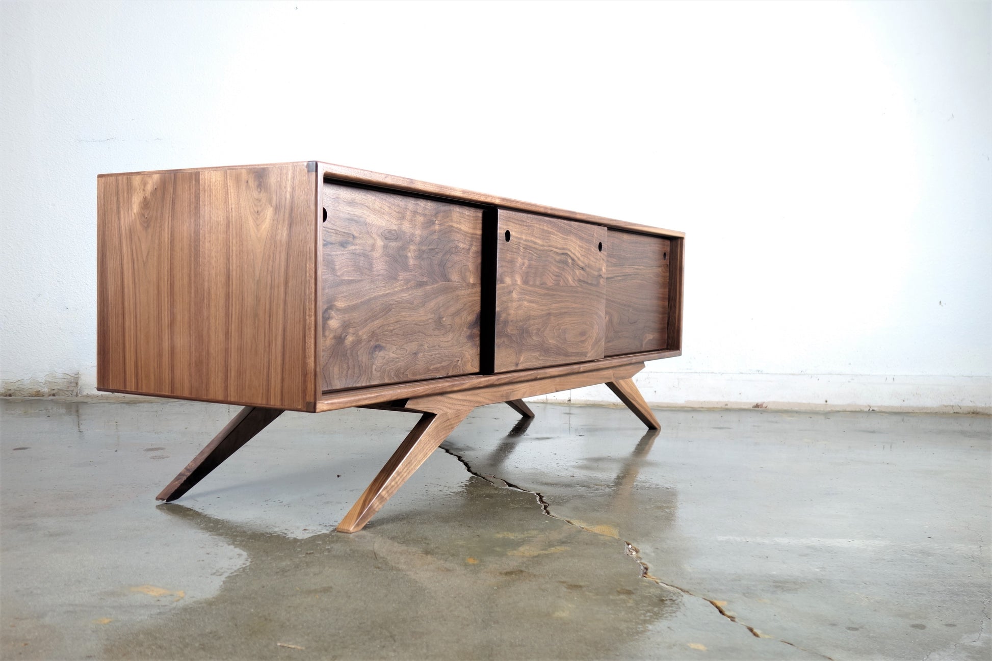 Walnut media console angled view mid century modern