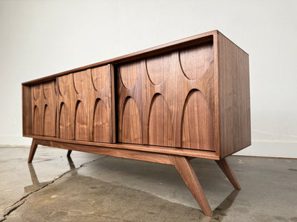 Walnut Stella J console angled view mid century modern sculpted doors